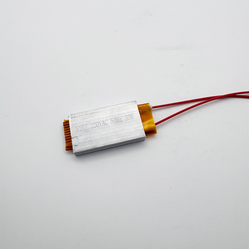 A compact 30W PTC heater plate securely housed in a silver aluminum shell.