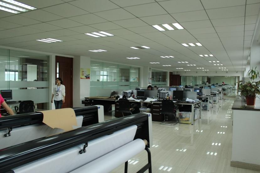 Spacious design office with CAD pattern plotting machines for custom apparel development