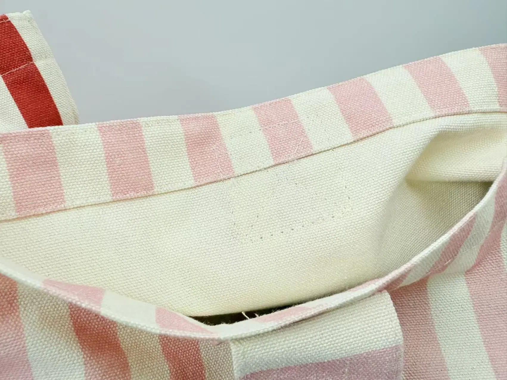 LUCKYSTAR striped bag seam and handle detail