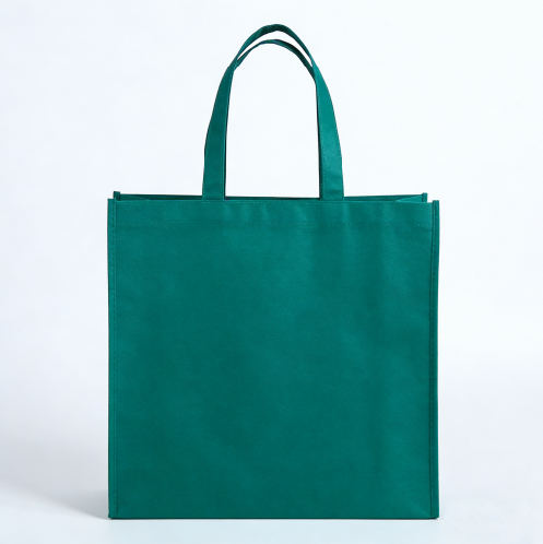 Plain green non-woven shopping bag showing a broad potential printing panel