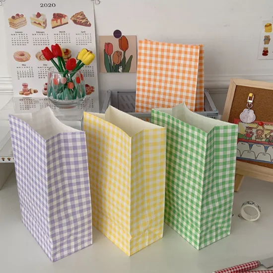 Plaid paper shopping bags in several colorways