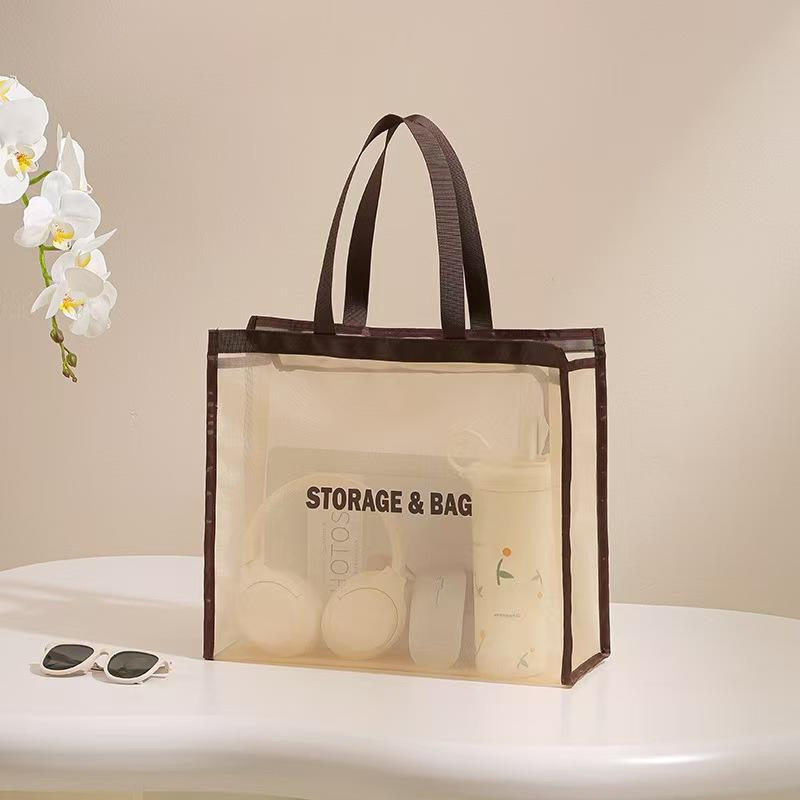 Mesh shopping bag with contrasting handle and binding