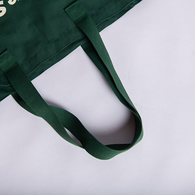 Handle webbing and attachment detail on a reusable bag sample