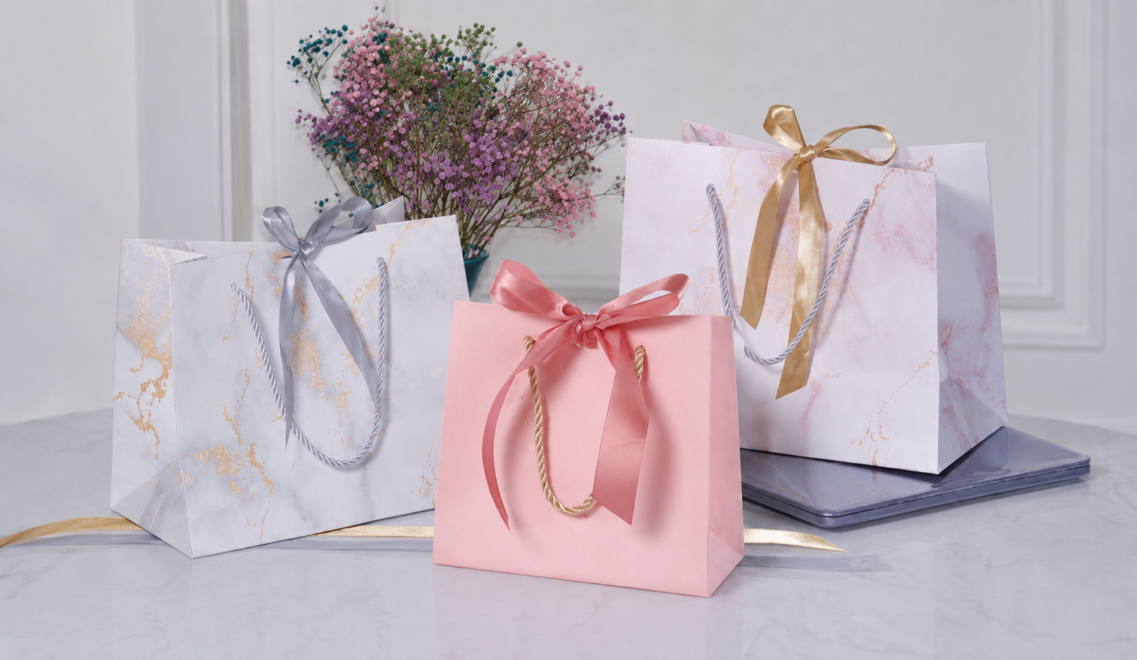 Unbranded premium paper shopping bags with rope and ribbon handles based on LUCKYSTAR company catalog photography