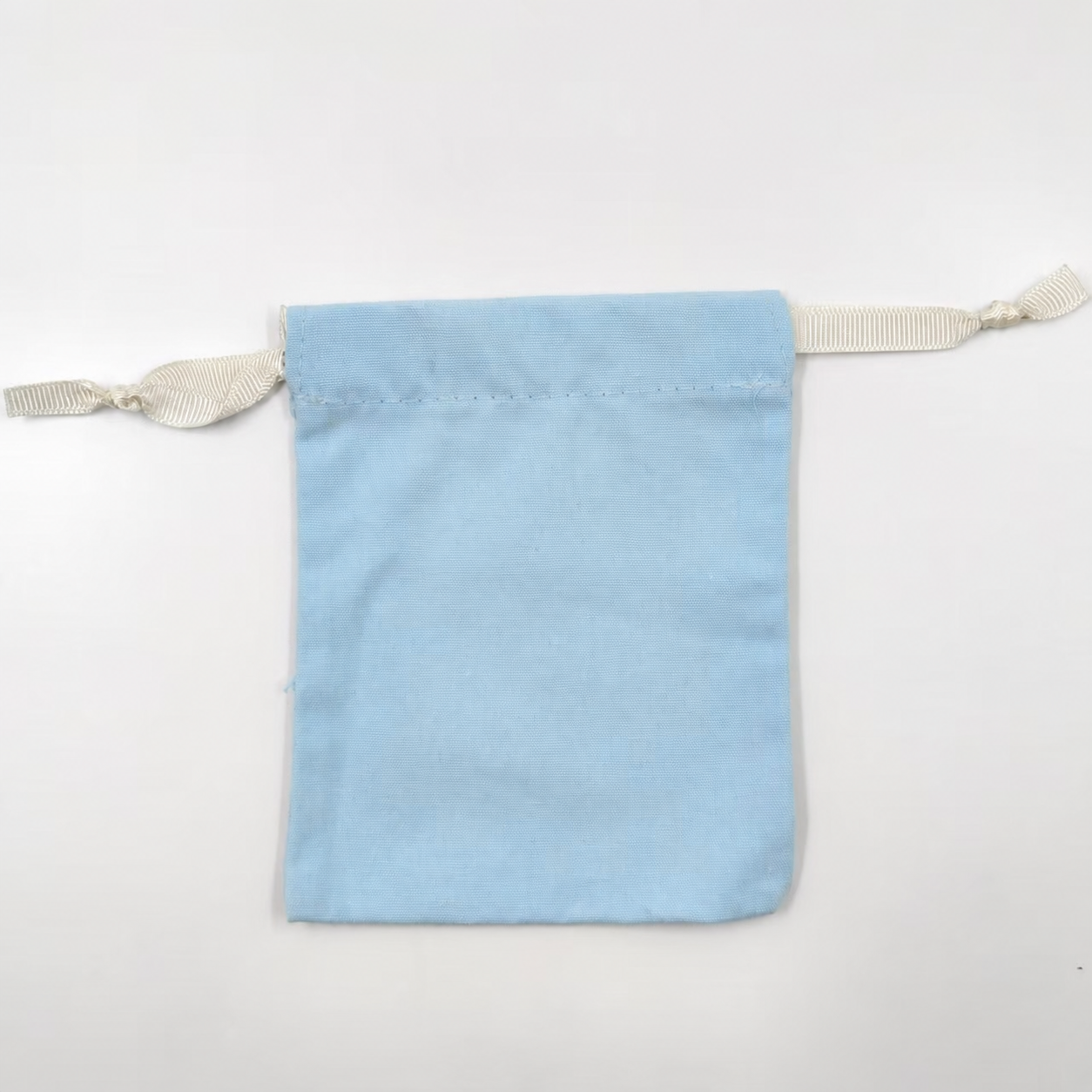 Real custom drawstring pouch showing channel, stitching and cord construction